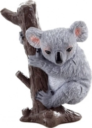 Plastic koala figurine on a tree
