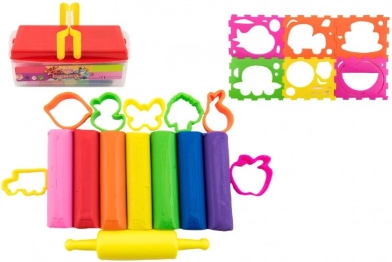 Set of colorful clays with cutters and roller in a plastic box