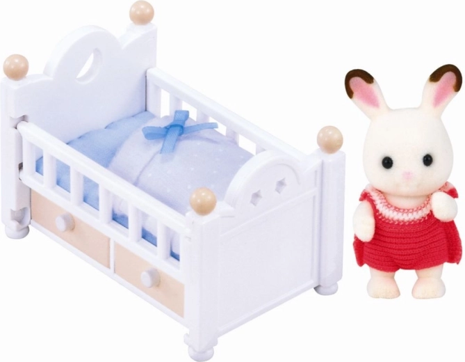 Coniglietto baby Chocolate nella culla – mini figura con accessori