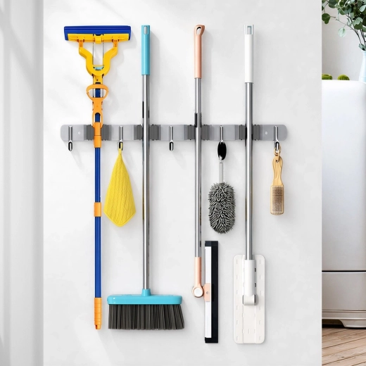 Organizing cleaning tools on the wall