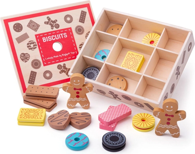 Scatola di legno con giocattoli a forma di biscotti