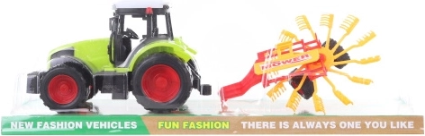 Trattore di plastica con voltafieno per bambini