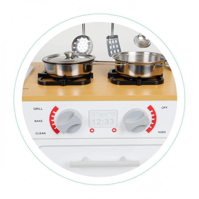 Wooden children's kitchen beside light + pots