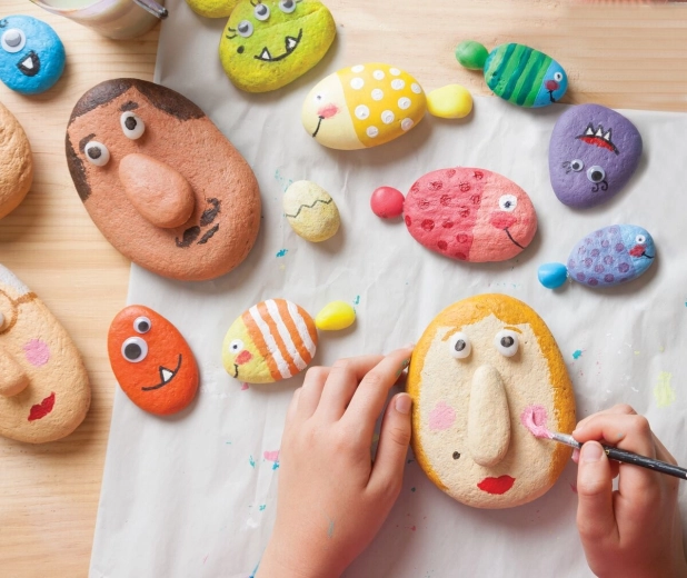 Cheerful pebbles with eyes and 3D details