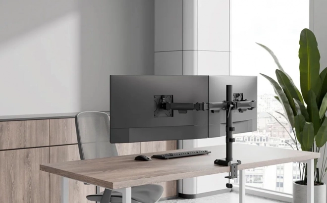 Adjustable dual monitor arm