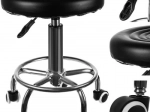 Swivel hairdressing stool on casters with adjustable height