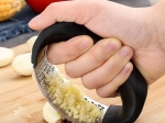 Ergonomic stainless steel garlic press