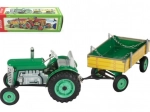 Grüner Zetor Traktor mit Anhänger und Federwerk Kovap